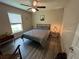 Cozy bedroom with soft lighting, wood-look floors, and modern decor, creating a welcoming space at 7488 Sw 204Th Ave, Dunnellon, FL 34431