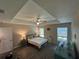 Spacious bedroom with vaulted ceiling, fan, and natural light from dual windows at 7488 Sw 204Th Ave, Dunnellon, FL 34431