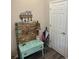 Light-filled entryway decorated with a decorative bench, wall decor, and a white six panel door at 7488 Sw 204Th Ave, Dunnellon, FL 34431