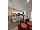 Bright kitchen featuring white cabinets, stainless steel appliances, granite counters, and an island at 7488 Sw 204Th Ave, Dunnellon, FL 34431