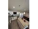Bright kitchen with stainless steel appliances, granite countertops, and an island with pendant lighting at 7488 Sw 204Th Ave, Dunnellon, FL 34431