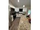 Modern kitchen with stainless steel appliances, granite counters, and lots of cabinet space at 7488 Sw 204Th Ave, Dunnellon, FL 34431
