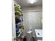 Organized laundry and storage room featuring shelving and ample storage space at 7488 Sw 204Th Ave, Dunnellon, FL 34431
