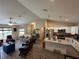 Open-concept living space with modern kitchen, granite island, and stainless steel appliances at 7488 Sw 204Th Ave, Dunnellon, FL 34431