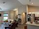 Open-concept living space with modern kitchen, granite island, and stainless steel appliances at 7488 Sw 204Th Ave, Dunnellon, FL 34431