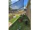 Side yard with shade, featuring potted plants, and lush greenery at 7488 Sw 204Th Ave, Dunnellon, FL 34431