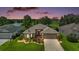 Beautiful single-story home boasts a well-manicured lawn with lake and golf course views in a lovely neighborhood at 8545 Se 168Th Kittredge Loop, The Villages, FL 32162