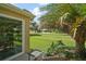 Scenic backyard view of the golf course and landscaping at 8545 Se 168Th Kittredge Loop, The Villages, FL 32162