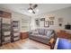Comfortable bedroom with a ceiling fan, a wooden dresser, and decorations on the wall at 8545 Se 168Th Kittredge Loop, The Villages, FL 32162