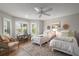Charming bedroom provides two twin beds, a ceiling fan, and natural light at 8545 Se 168Th Kittredge Loop, The Villages, FL 32162