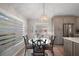 Charming breakfast nook with a stylish light fixture that complements the home's interior design at 8545 Se 168Th Kittredge Loop, The Villages, FL 32162