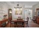 An open concept dining room features natural light, stylish decor, and wood flooring at 8545 Se 168Th Kittredge Loop, The Villages, FL 32162