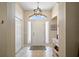 Welcoming front entrance with decorative sidelights and ample natural light at 8545 Se 168Th Kittredge Loop, The Villages, FL 32162