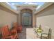 Inviting front porch with comfortable rocking chairs and seating area at 8545 Se 168Th Kittredge Loop, The Villages, FL 32162