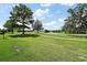Picturesque view of the golf course and pond from the property at 8545 Se 168Th Kittredge Loop, The Villages, FL 32162