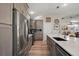 Well-equipped kitchen with stainless steel appliances and quartz countertops with seamless flow to dining area at 8545 Se 168Th Kittredge Loop, The Villages, FL 32162