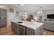 Open concept kitchen featuring a large island that overlooks the living room, perfect for entertaining at 8545 Se 168Th Kittredge Loop, The Villages, FL 32162