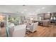 Bright living space with open floor plan to the kitchen and outdoor view at 8545 Se 168Th Kittredge Loop, The Villages, FL 32162