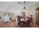 Spacious open-concept living area with hardwood floors and updated kitchen at 8545 Se 168Th Kittredge Loop, The Villages, FL 32162
