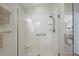 The modern shower offers grab bars, a bench, and a glass door for easy access at 8545 Se 168Th Kittredge Loop, The Villages, FL 32162