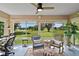 Bright sunroom featuring scenic views, comfortable seating, and a desk for work at 8545 Se 168Th Kittredge Loop, The Villages, FL 32162