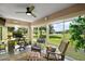 Cozy sunroom with floor-to-ceiling windows offering scenic views and comfortable seating at 8545 Se 168Th Kittredge Loop, The Villages, FL 32162