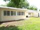 This backyard features a well-maintained lawn, a patio, and an AC unit on side of home at 8653 Sw 95Th Ln # F, Ocala, FL 34481