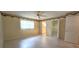 A bright bedroom with tiled floors, window and ceiling fan at 8653 Sw 95Th Ln # F, Ocala, FL 34481