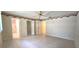 A bright bedroom with tiled floors, closet and open access to the en suite bathroom at 8653 Sw 95Th Ln # F, Ocala, FL 34481