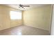A bright bedroom with tiled flooring and a window that lets in plenty of natural light at 8653 Sw 95Th Ln # F, Ocala, FL 34481