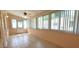Bright and spacious Florida room featuring tile floors, multiple windows and back door access at 8653 Sw 95Th Ln # F, Ocala, FL 34481