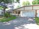 Charming single-story home featuring a well-manicured lawn and a two-car garage at 8653 Sw 95Th Ln # F, Ocala, FL 34481