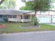 Charming single-story home featuring a well-manicured lawn and a two-car garage at 8653 Sw 95Th Ln # F, Ocala, FL 34481