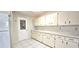 Spacious kitchen offering ample counter space and storage in white cabinetry at 8653 Sw 95Th Ln # F, Ocala, FL 34481