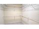 Spacious walk-in closet with multiple shelves and rods for ample storage in this home at 8653 Sw 95Th Ln # F, Ocala, FL 34481