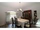 Charming dining room with a formal table setting and a display cabinet at 9129 Sw 193Rd Cir, Dunnellon, FL 34432
