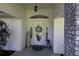 Charming front entrance with a decorative door, sidelights, and brick pillar at 9129 Sw 193Rd Cir, Dunnellon, FL 34432