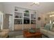 Bright living room with built-in shelving, display niches and an open layout at 9129 Sw 193Rd Cir, Dunnellon, FL 34432
