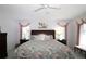 Bright and comfortable primary bedroom with a large bed and coordinated decor at 9129 Sw 193Rd Cir, Dunnellon, FL 34432
