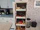Bright pantry featuring pull-out shelving for optimal organization and storage space at 9129 Sw 193Rd Cir, Dunnellon, FL 34432