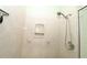 Shower showcasing sleek fixtures, a built-in soap dish, and a towel bar for easy access at 9129 Sw 193Rd Cir, Dunnellon, FL 34432