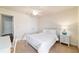 Serene bedroom with a cozy bed, ceiling fan, and ample natural light, perfect for relaxation and restful sleep at 9595 Sw 51St Cir, Ocala, FL 34476