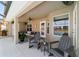 Inviting covered patio with comfortable seating, ceiling fans, and view of the pool at 9595 Sw 51St Cir, Ocala, FL 34476