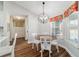 Cozy dining area featuring a wood table and chairs, with views of the backyard at 9595 Sw 51St Cir, Ocala, FL 34476