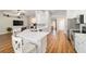 Bright kitchen with white cabinets, stainless steel appliances, and a breakfast bar area at 9595 Sw 51St Cir, Ocala, FL 34476