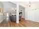 View of open-concept living room with hardwood floors and view to dining area at 9595 Sw 51St Cir, Ocala, FL 34476