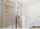 Ensuite bathroom features a separate soaking tub and glass enclosed shower at 9595 Sw 51St Cir, Ocala, FL 34476