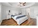 This is the main bedroom which features a tray ceiling and hardwood floors at 9595 Sw 51St Cir, Ocala, FL 34476