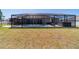 Spacious screened pool and spa with patio seating at 9595 Sw 51St Cir, Ocala, FL 34476