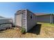 Backyard shed provides extra storage and complements the house at 9595 Sw 51St Cir, Ocala, FL 34476